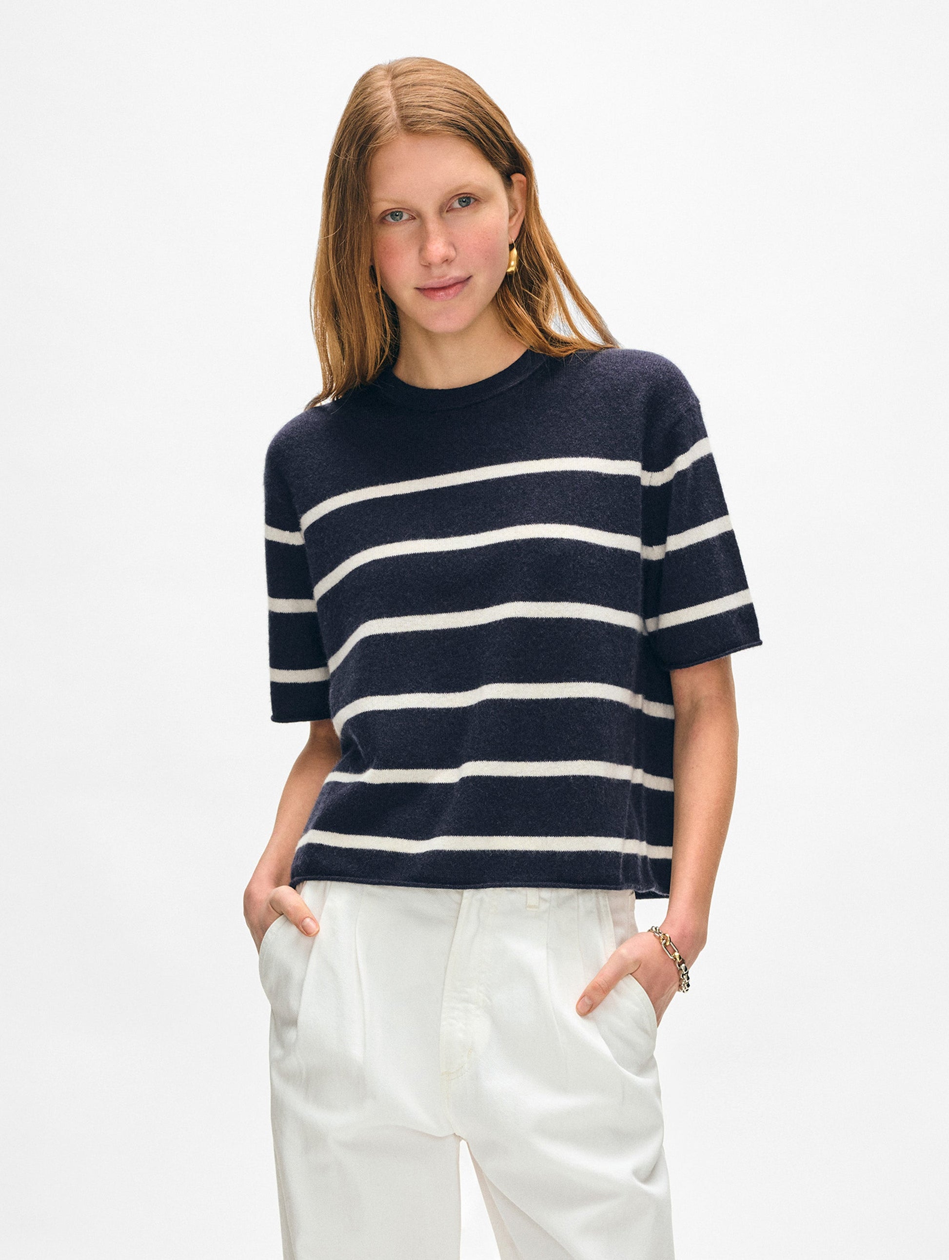 Model wearing cashmere navy and white striped t shirt.