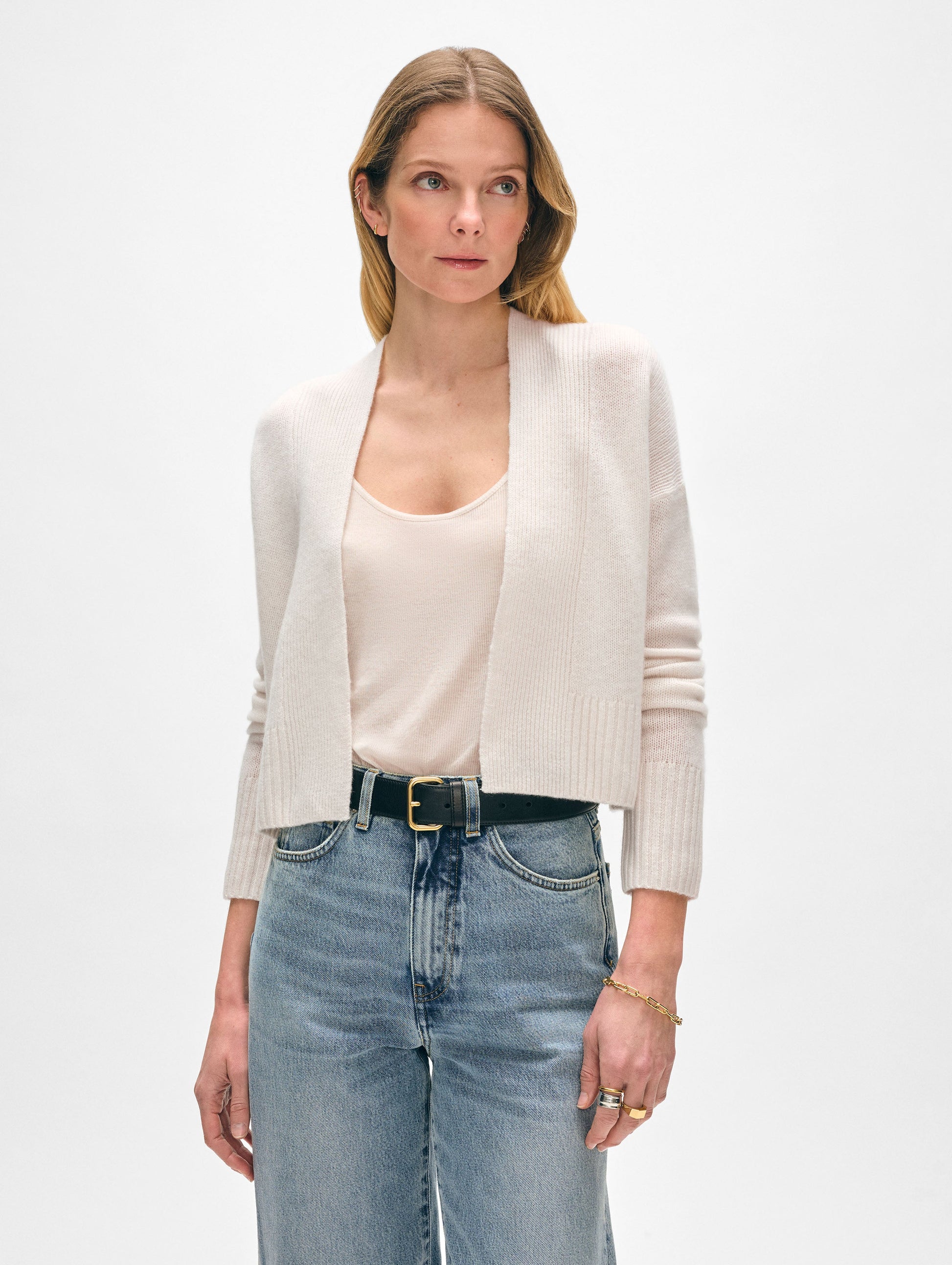 Model wearing cashmere cropped open cardigan.