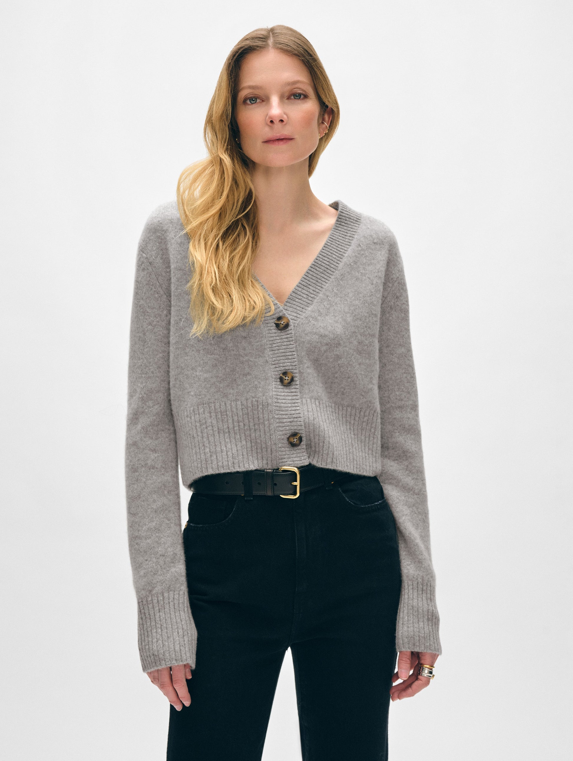 Model wearing grey cashmere button cardigan.