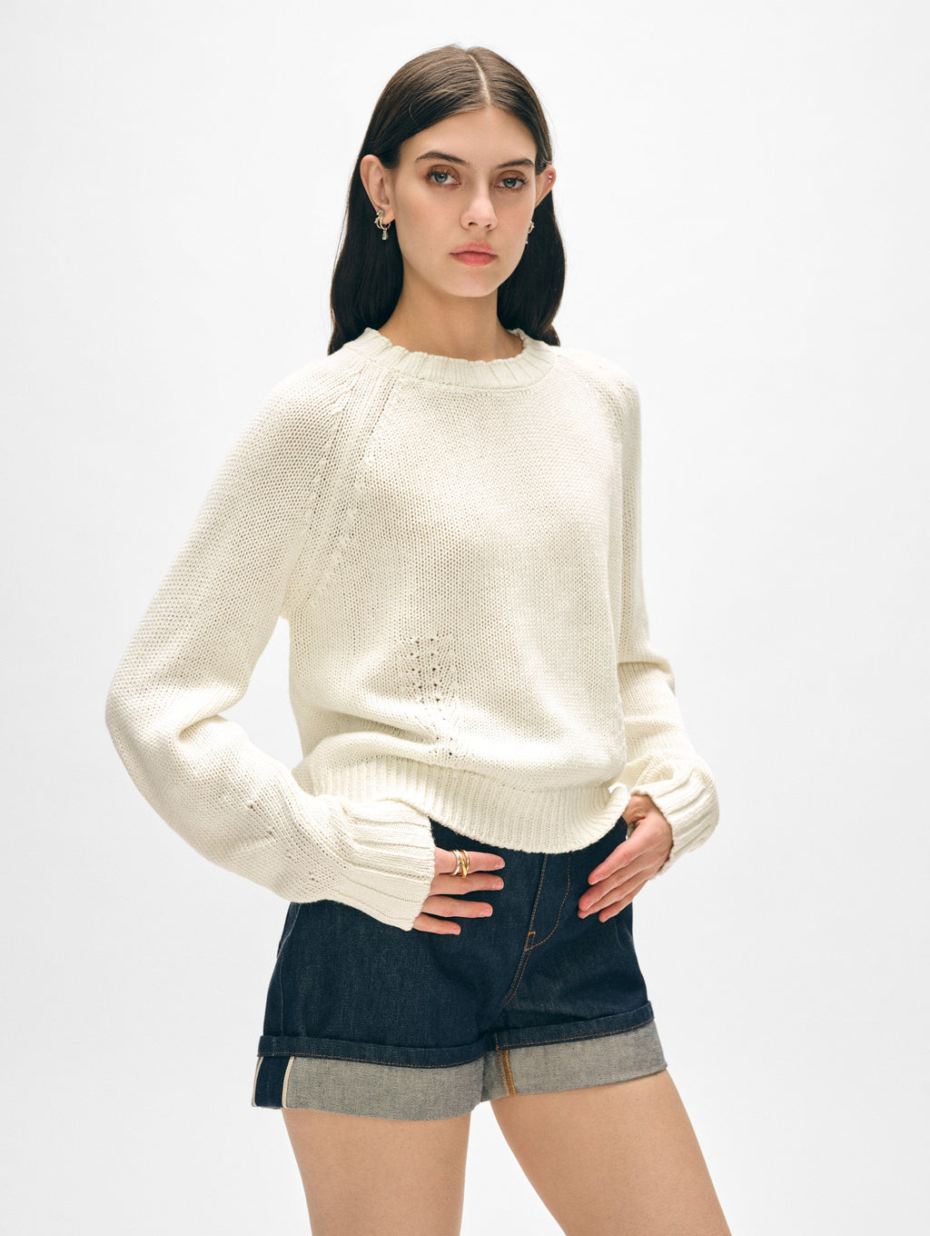 Model wearing white cotton crewneck sweater.