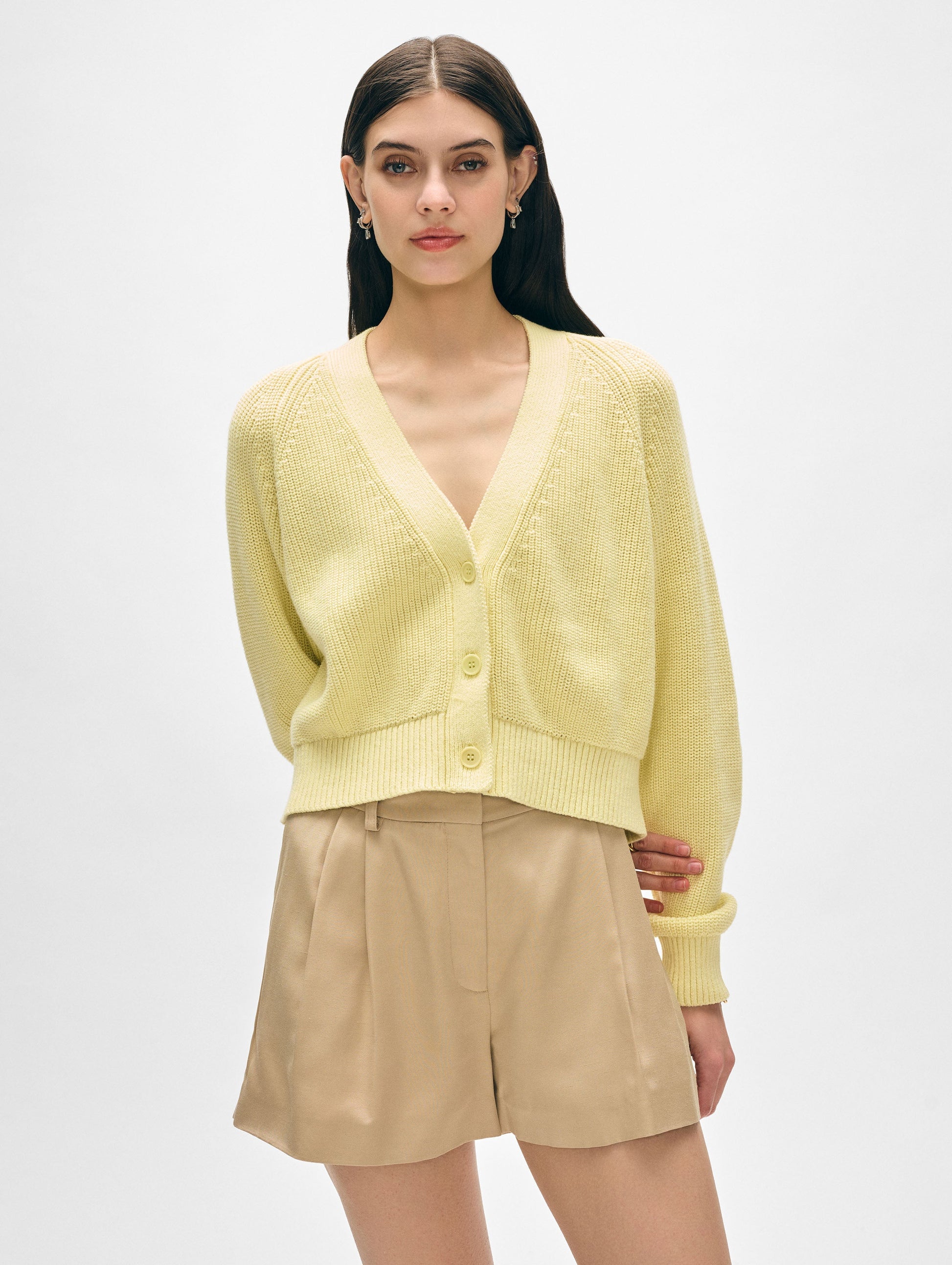 Model wearing yellow cotton button cardigan.